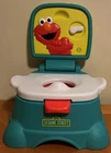 Sesame Street Elmo Hooray 3-IN-1 Potty Chair, Toilet Trainer, Step Stool, Flush Used. Price: $37.99.