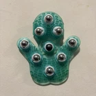 Samyo Palm Shaped Glove Body Massager With 9 360-DEGREE-ROLLER Metal Used. Price: $7.99.
