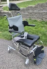 Raz-at Attendant Tilt Mobile Shower Chair Commode 18"WIDE X 20" Deep Seat Used. Price: $1400.00.