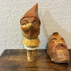 2 German Folk Art Hand Carved Wood Cork Wine Bottle Stopper Of Men Pinocchio Used. Price: $18.00.
