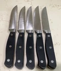 Set Of 5 Steak Knives Stainless Steel With Black Riveted Wood Look Grips, Hefty Used. Price: $22.00.