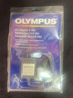Olympus E-7AU Adapter For New In Package. Price: $9.99.