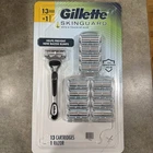 Gillette Skinguard Razor With Aloe Sensitive + 13 Refill Cartridges Blade New. Price: $31.99.